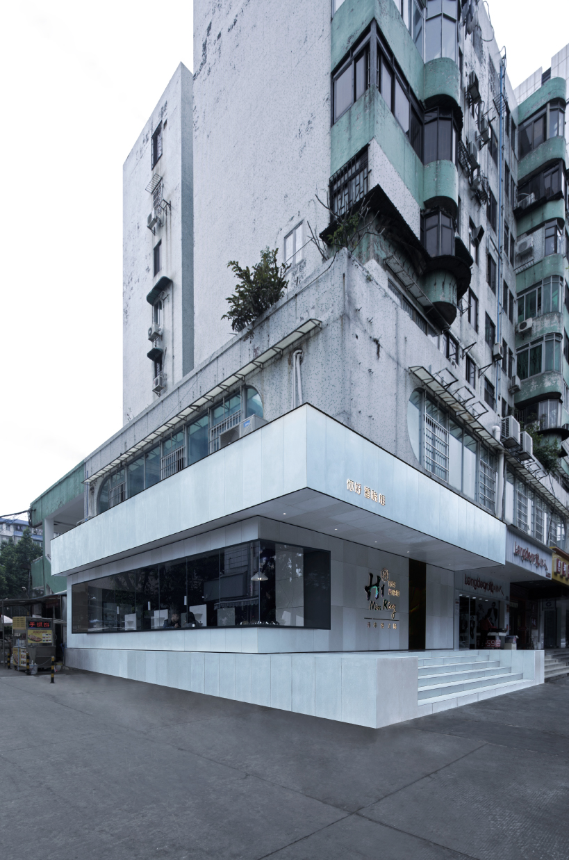 iridescent diner by infinity nide features colored, electroplated steel and white concrete