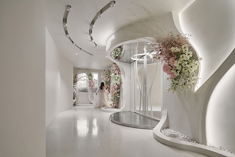 antistatics architecture echoes rippling fabric in perforated metal at wedding center in china