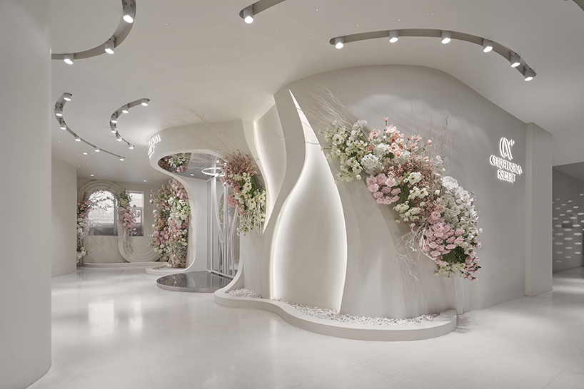 antistatics architecture echoes rippling fabric in perforated metal at wedding center in china