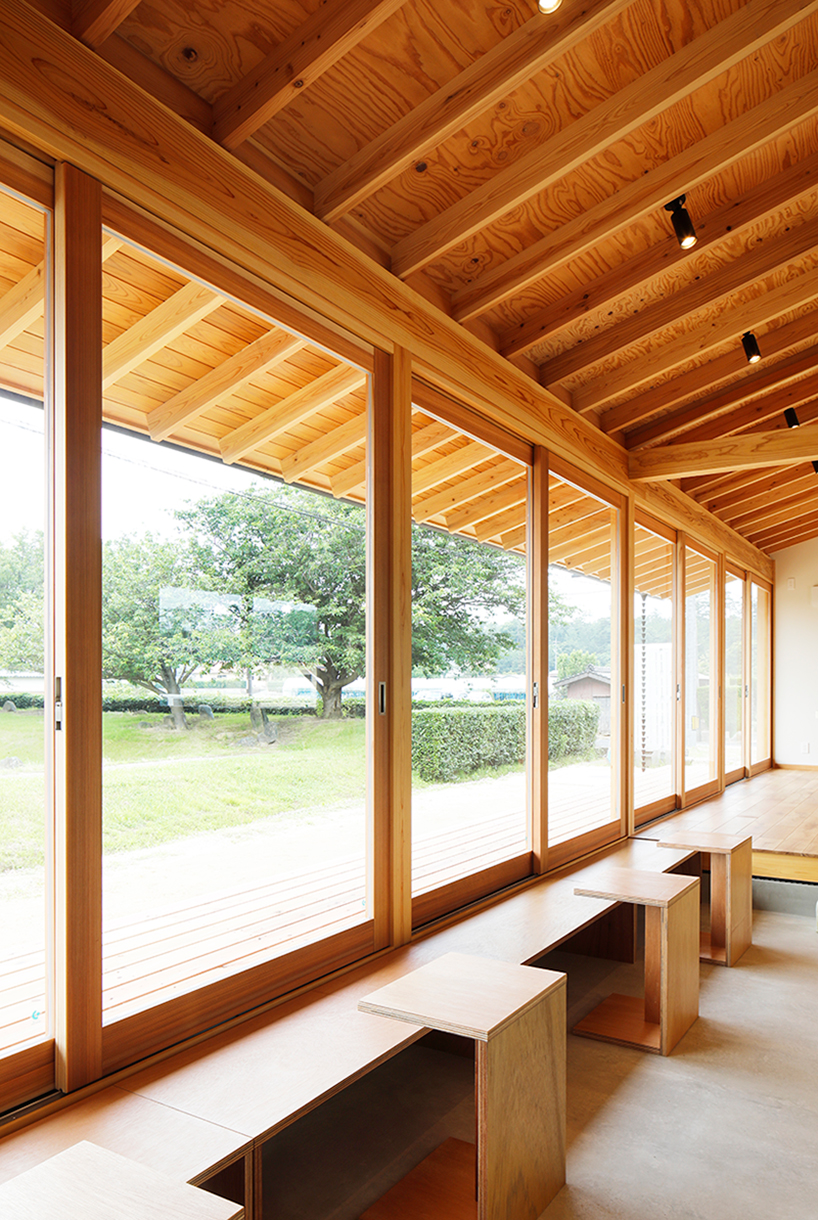 wooden coffee shop in japan sets up multileveled interiors under an eave roof - 4
