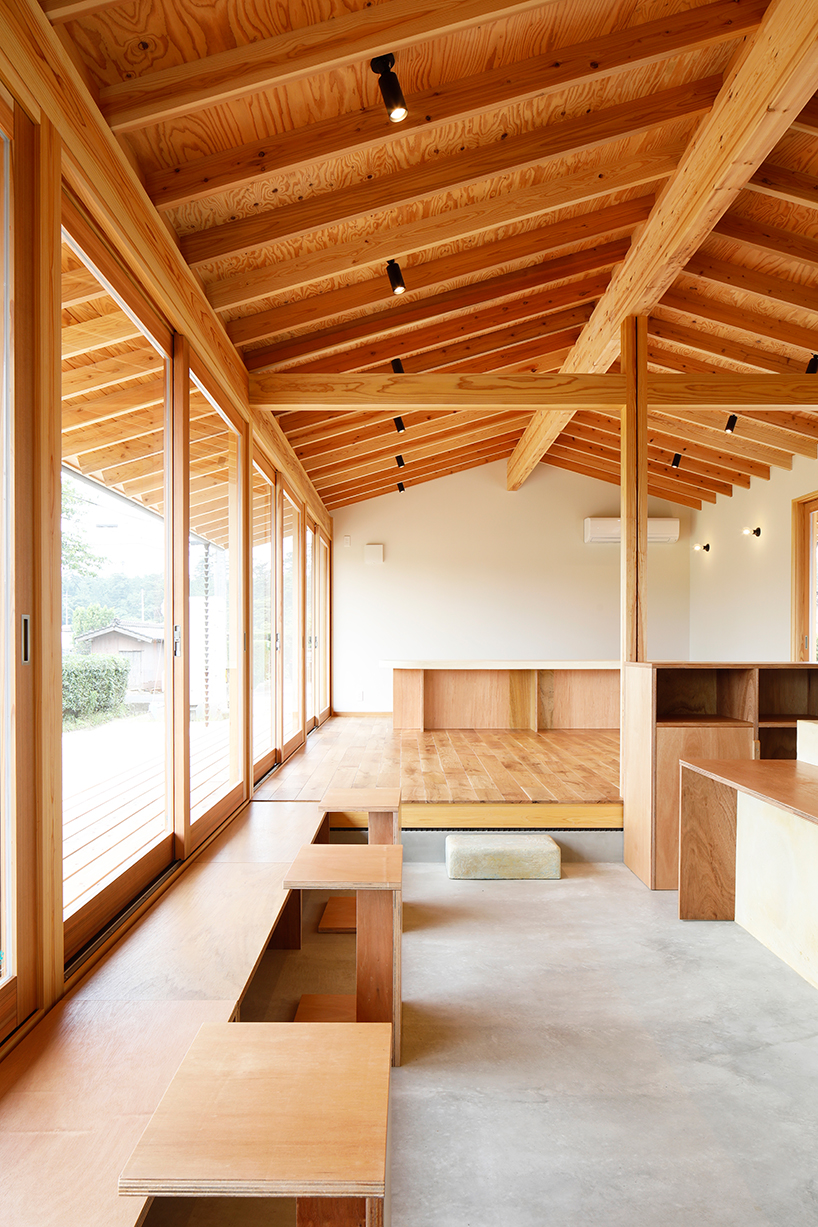 wooden coffee shop in japan sets up multileveled interiors under an eave roof - 5