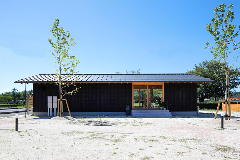 wooden coffee shop in japan sets up multileveled interiors under an eave roof - 6