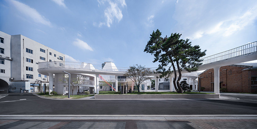 floating cloud corridor hovers above minax's factory renovation in china 