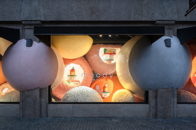WAY studio creates a dreamy window display with gigantic balls of yarn in shanghai designboom