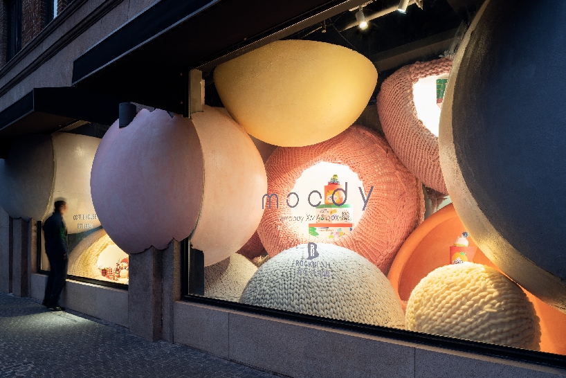 WAY studio creates a dreamy window display with gigantic balls of yarn in shanghai designboom