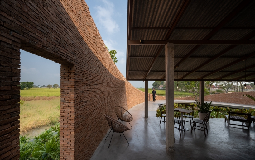 bodinchapa architects integrates naya cafe into the ever-changing rice fields in thailand