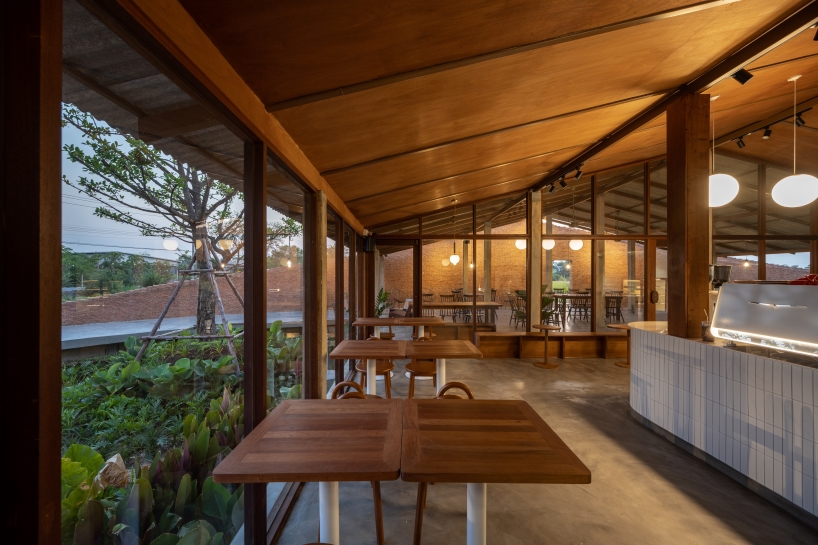 bodinchapa architects integrates naya cafe into the ever-changing rice fields in thailand