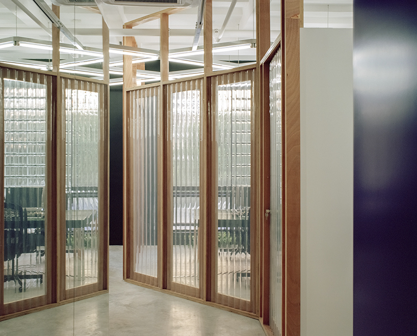 archive divides an office in shanghai with plywood-framed screens - 2