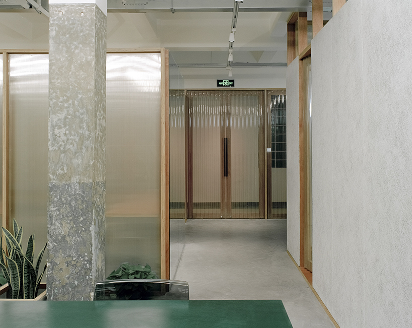 archive divides an office in shanghai with plywood-framed screens - 3