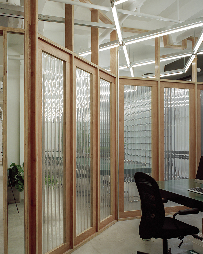 studio archive divides an office in shanghai by plywood-framed screens designboom