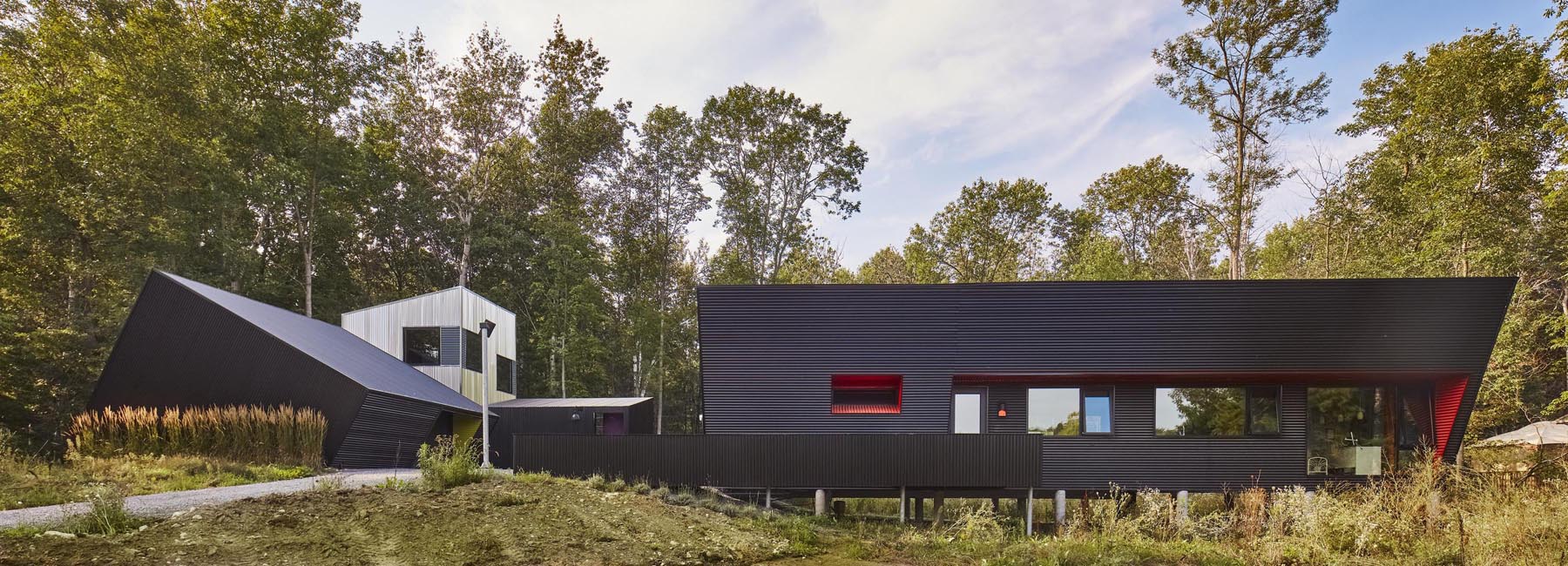 thier + curran architects' retirement dwelling in ontario is clad in black corrugated metal