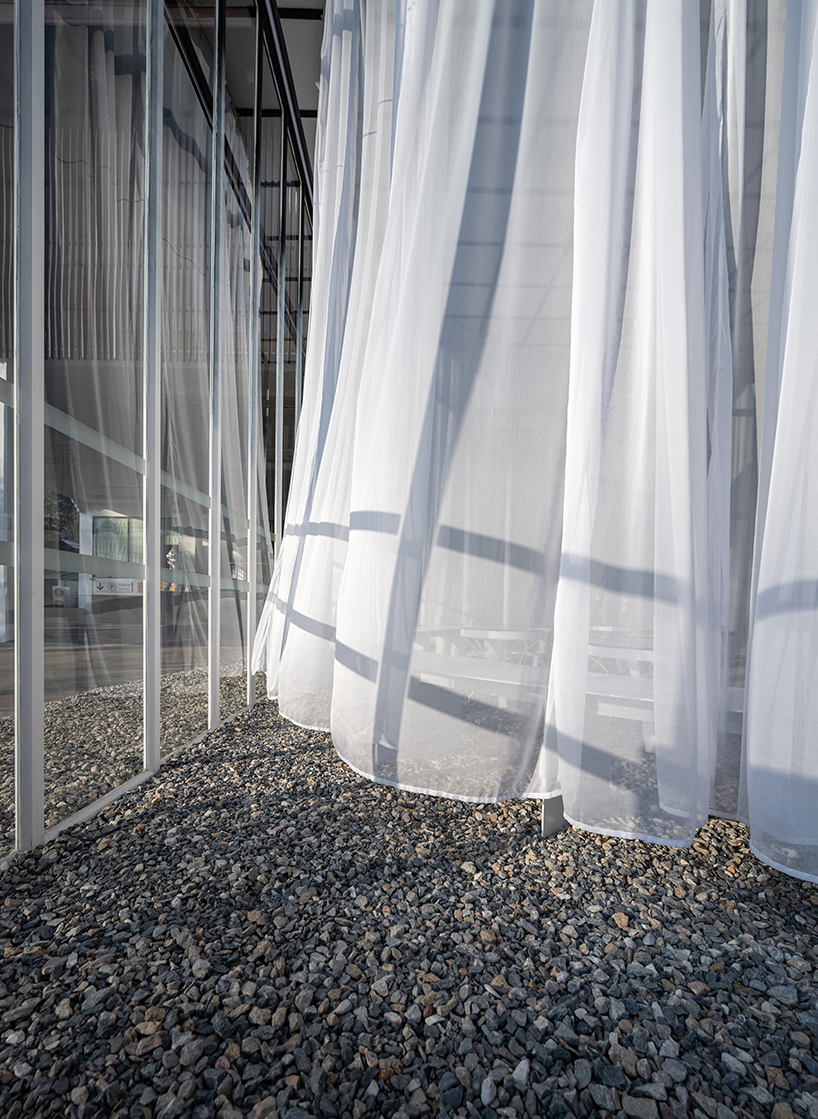 sher maker wraps curtains around a multifunctional space in chiangmai designboom