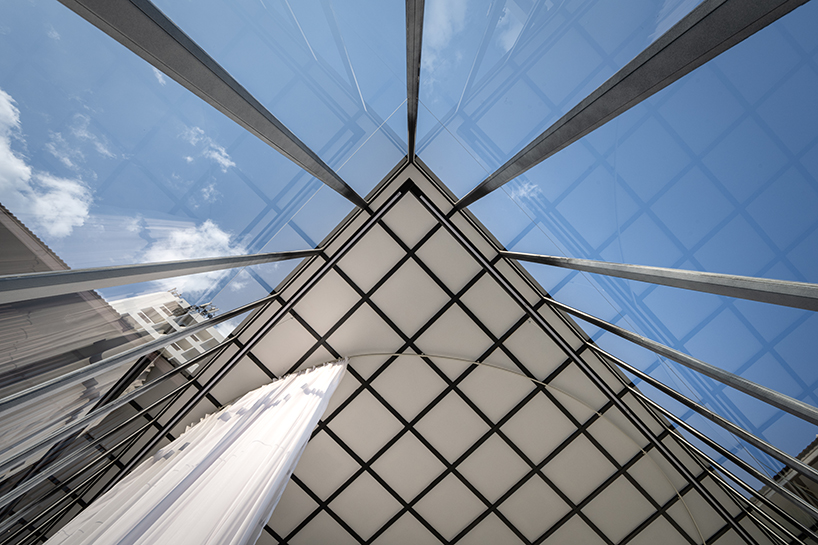 sher maker wraps curtains around a multifunctional space in chiangmai designboom