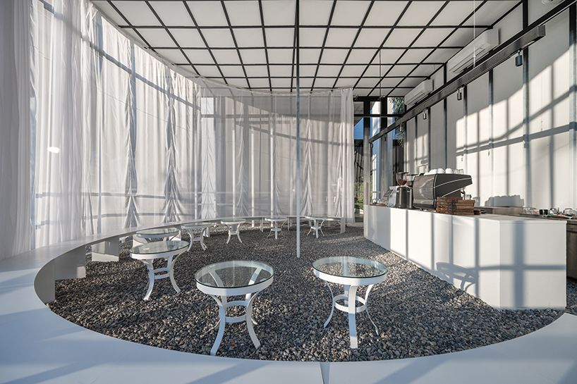 sher maker wraps curtains around a multifunctional space in chiangmai designboom