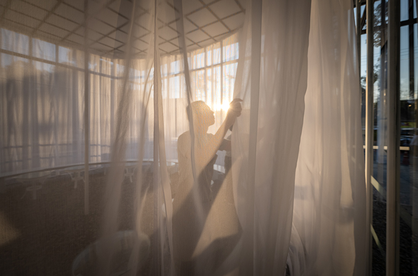 sher maker wraps curtains around a multifunctional space in chiangmai designboom