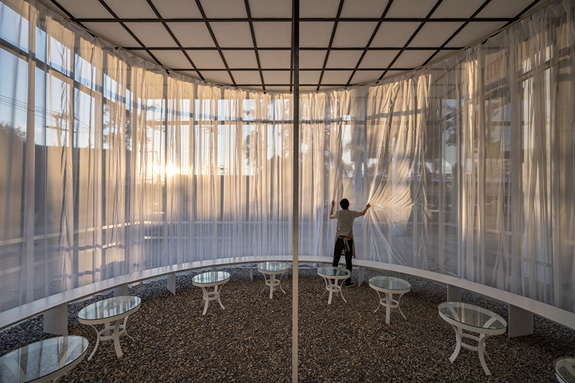 sher maker wraps curtains around a multifunctional space in chiangmai designboom