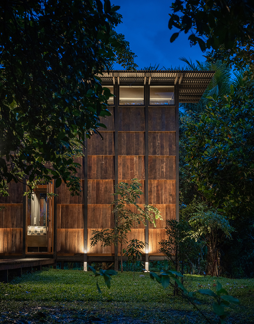  wooden off-grid cabin by sher maker connects travelers to the serene mountainous landscape of thailand