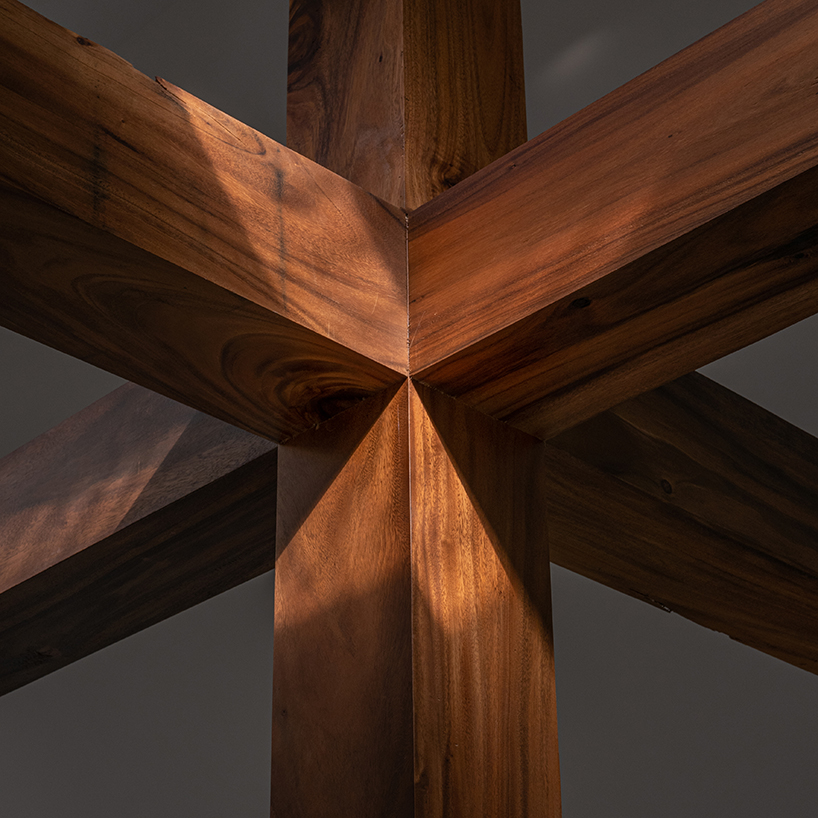 gabled longhouse showroom by sher maker celebrates artisanal woodworking in chiang mai