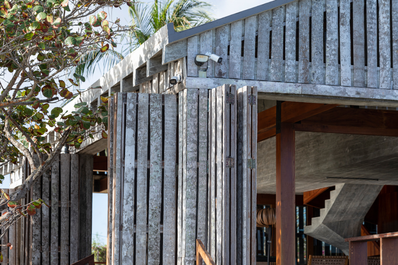 palm wood skin shields residence + portico structure by infraestudio in havana