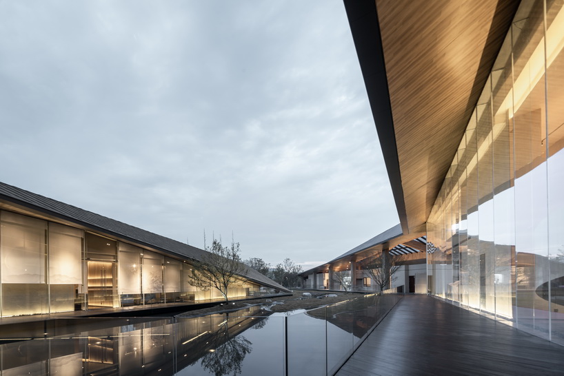 XAA's lakeside academy appears to float on water in meishan city, china designboom