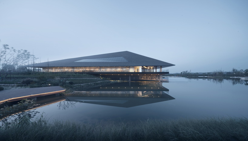 XAA's lakeside academy appears to float on water in meishan city, china designboom