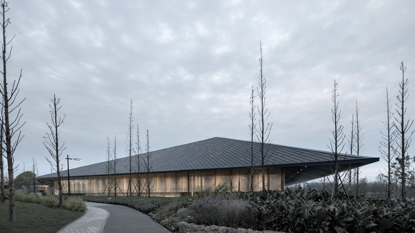 XAA's lakeside academy appears to float on water in meishan city, china designboom