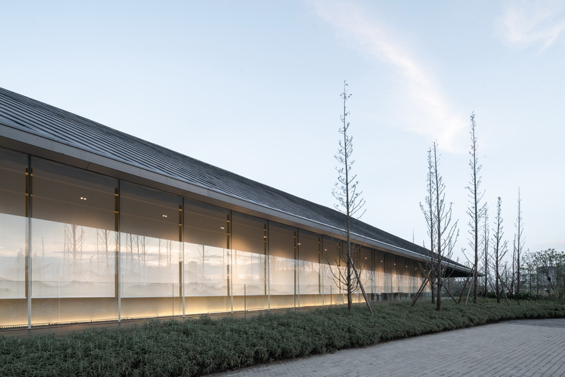 XAA's lakeside academy appears to float on water in meishan city, china designboom