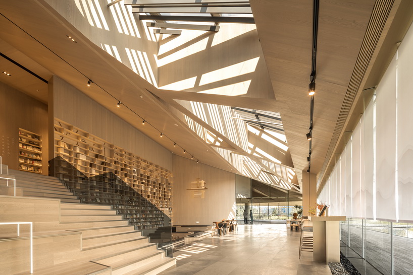 XAA's lakeside academy appears to float on water in meishan city, china designboom