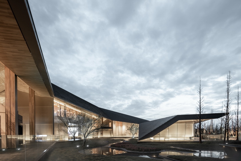 XAA's lakeside academy appears to float on water in meishan city, china designboom