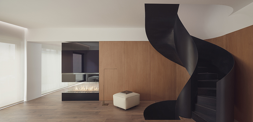 balzar adds scluptural curved staircase to residential renovation in spain