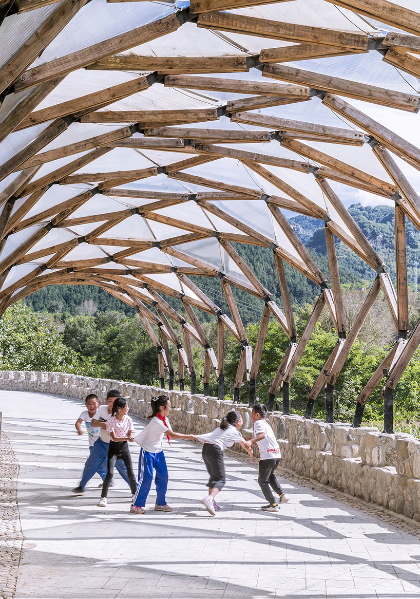 LUO reuses leftover materials of renovated chinese village to build a pergola for locals designboom