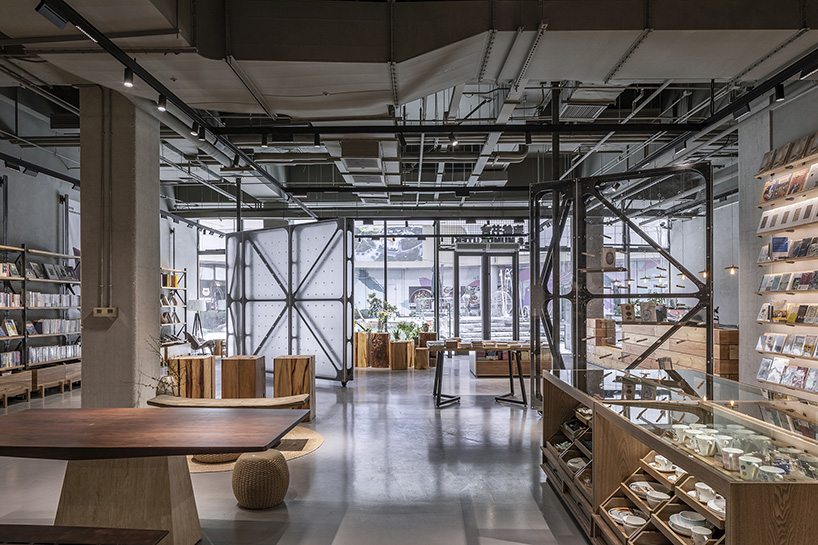 transparent rotating walls + exposed pipes assemble LUO studio's flexible bookstore space