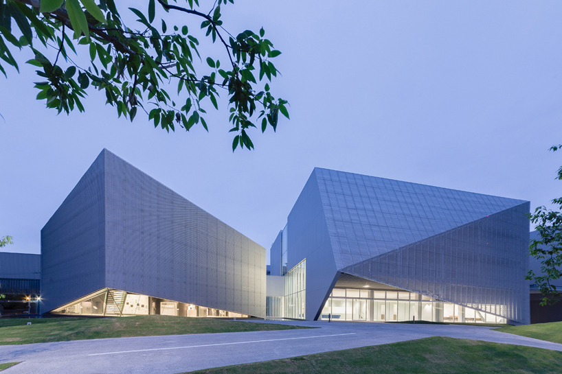 this transparent showroom in japan is surrounded by an artificial pond takenaka designboom