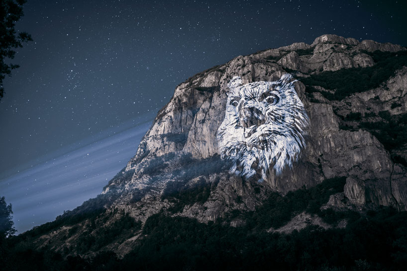 julien nonnon raises awareness by projecting endangered animals onto alpine mountains