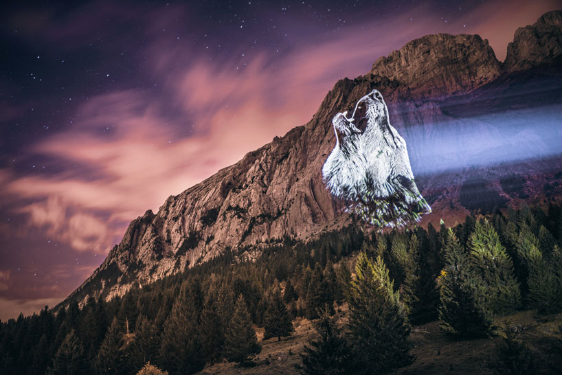 julien nonnon raises awareness by projecting endangered animals onto alpine mountains