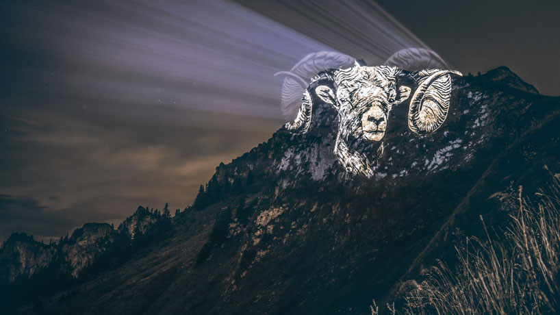 julien nonnon raises awareness by projecting endangered animals onto alpine mountains