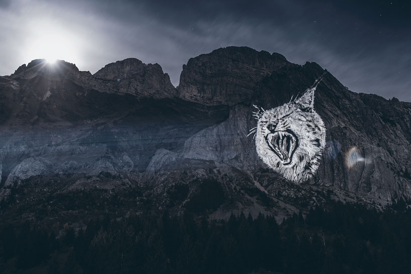 julien nonnon raises awareness by projecting endangered animals onto alpine mountains