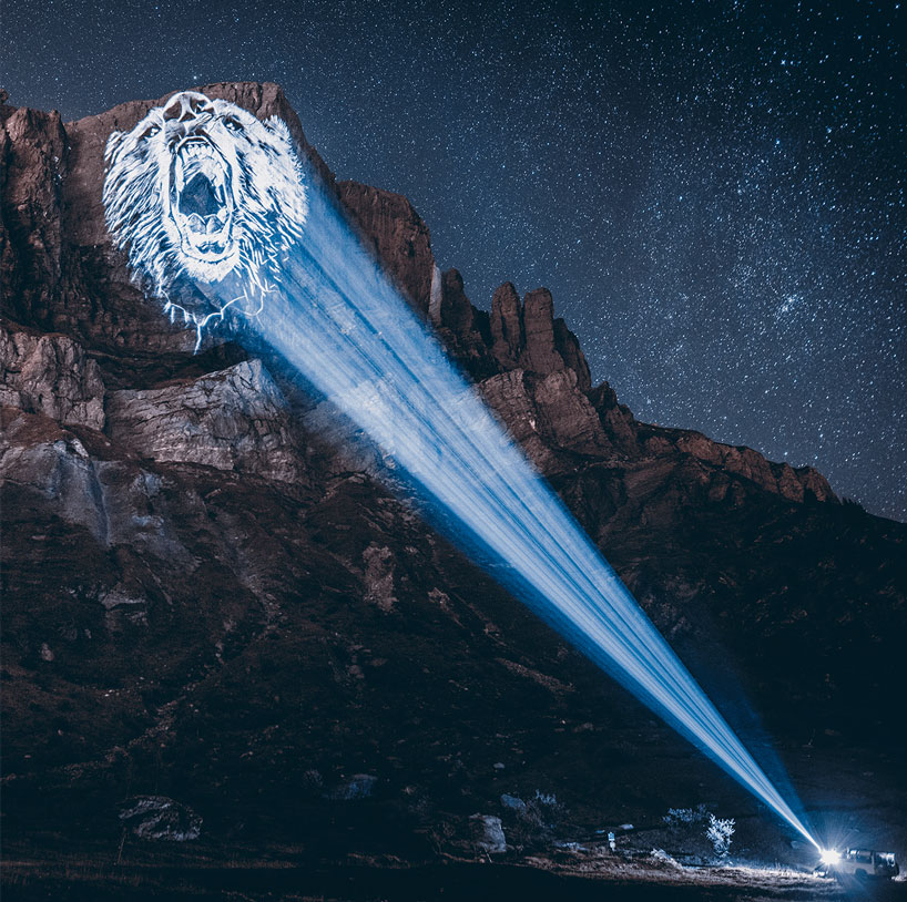 julien nonnon raises awareness by projecting endangered animals onto alpine mountains