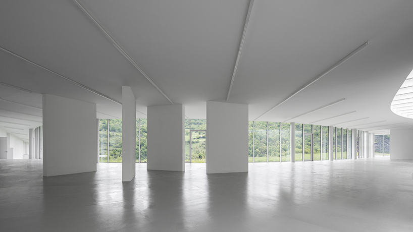 kaloustian's 'smart center' embraces the landscape of armenia in smooth, organic form