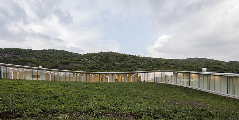 kaloustian's 'smart center' embraces the landscape of armenia in smooth, organic form
