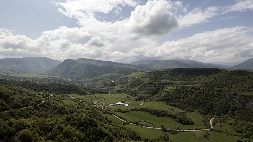 kaloustian's 'smart center' embraces the landscape of armenia in smooth, organic form