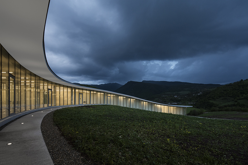kaloustian's 'smart center' embraces the landscape of armenia in smooth, organic form
