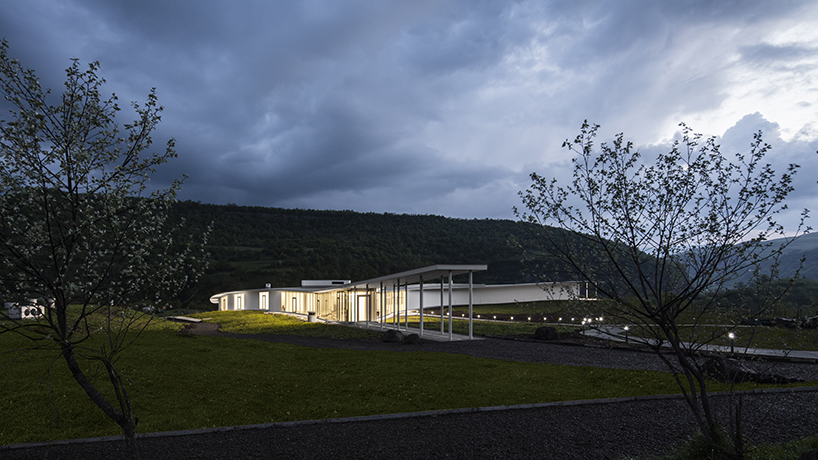 kaloustian's 'smart center' embraces the landscape of armenia in smooth, organic form