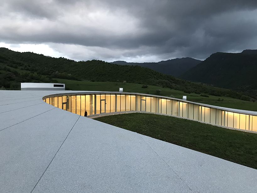 kaloustian's 'smart center' embraces the landscape of armenia in smooth, organic form