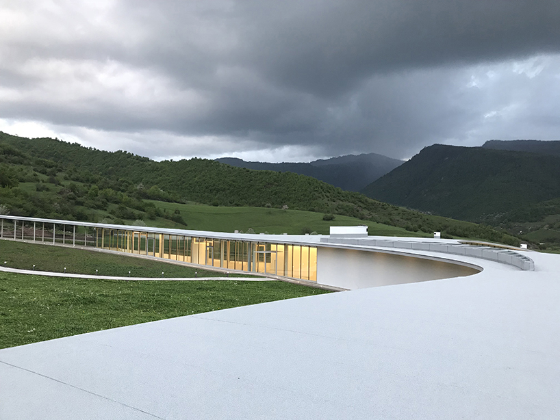 kaloustian's 'smart center' embraces the landscape of armenia in smooth, organic form