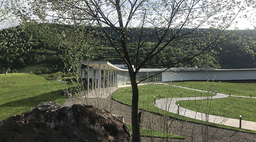 kaloustian's 'smart center' embraces the landscape of armenia in smooth, organic form