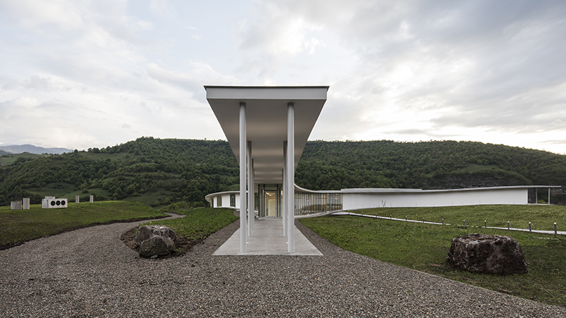 kaloustian's 'smart center' embraces the landscape of armenia in smooth, organic form