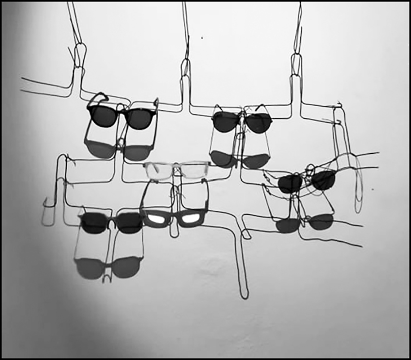 mold architects installs a metal curtain wall to display sunglasses in athens eyewear store designboom