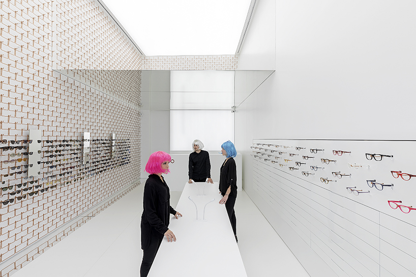 mold architects installs a metal curtain wall to display sunglasses in athens eyewear store designboom