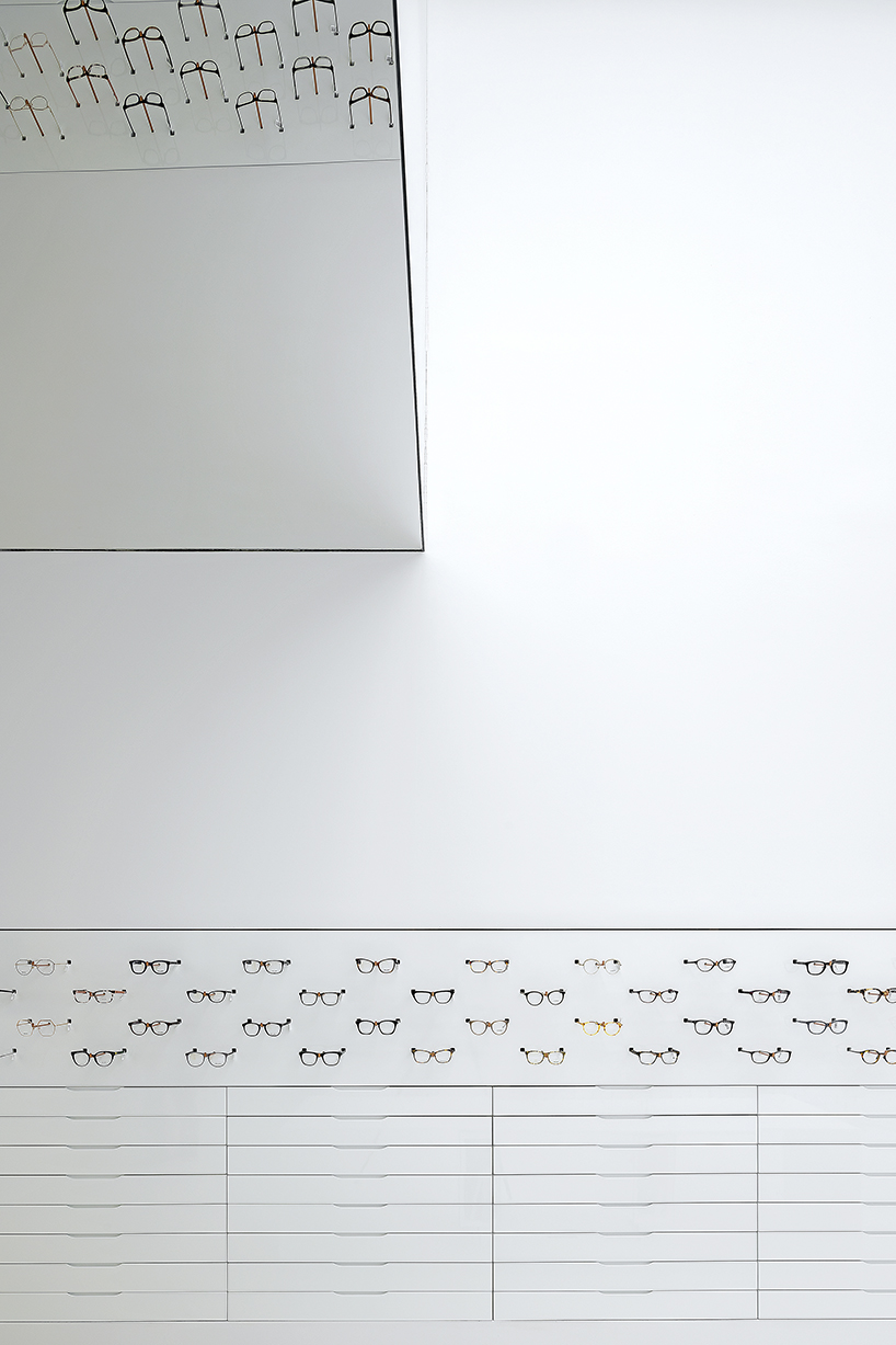 mold architects installs a metal curtain wall to display sunglasses in athens eyewear store designboom